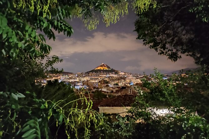 Athens at Night Enchanting Walking Tour and Dinner Delights - Plaka at night: Tripodon Street, classic churches, and Lysicrates views