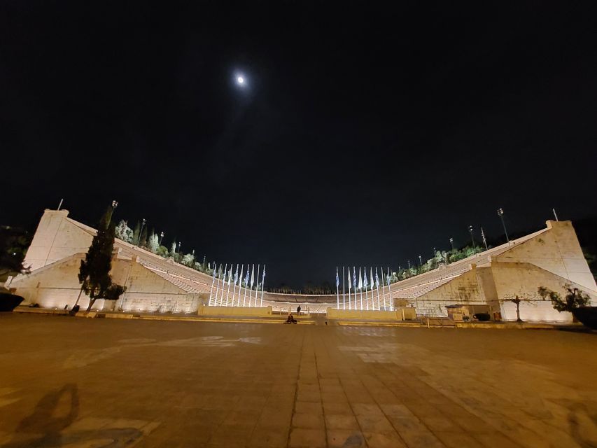 Athens: City Highlights Nighttime Walking Tour in Spanish - Zappeion inside the National Gardens, then the Panathenaic Stadium