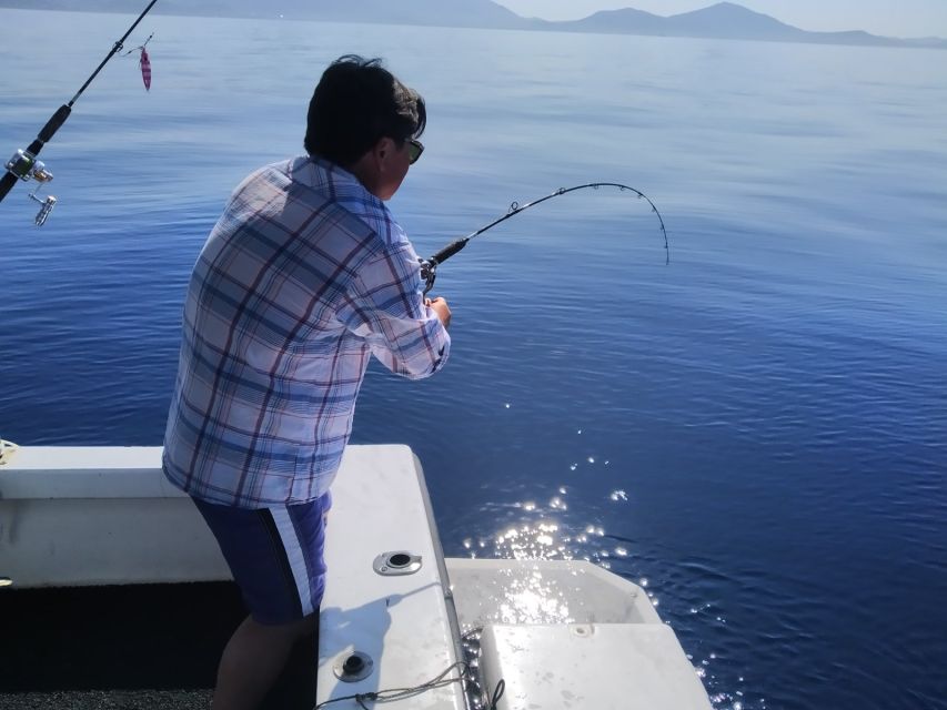 Athens: Fishing Trip Experience on a Boat with Seafood Meal - The onboard meal: snacks, traditional pie, Greek salad, shrimp pasta, and your catch