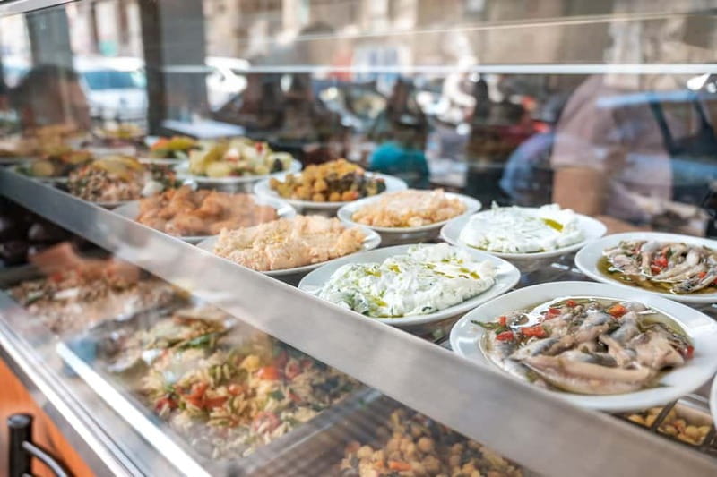 Athens: Guided Greek Food Walking Tour with Tastings - Market stalls and specialty shops: coffee, olives, mushrooms, and salami