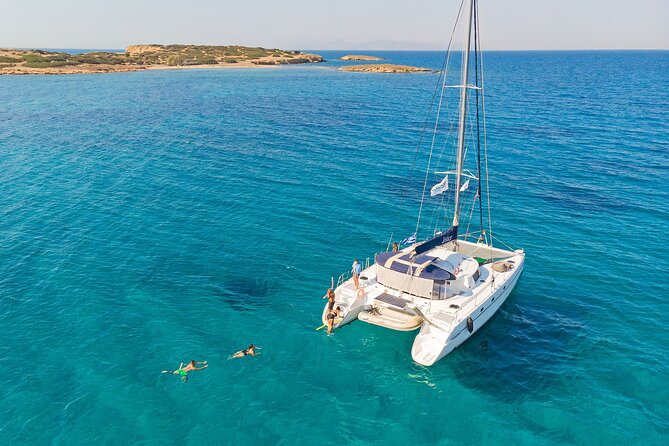 Athens Private Full day Catamaran cruise with meal & drinks - Stop 1: Aegina at Agia Marina bay for snorkeling and a first swim