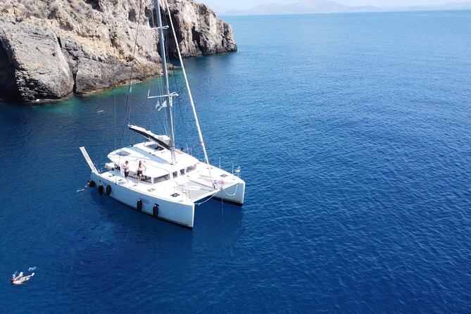 Athens Private Half day Catamaran cruise with meal & drinks - Stop 1 at Vouliagmeni: a sheltered bay swim to start