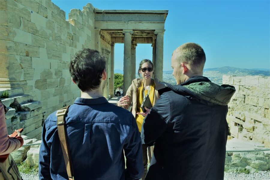 Athens: The Acropolis Guided Walking Tour in German - Following the sunny climb: Asklepieion and Herodes Atticus