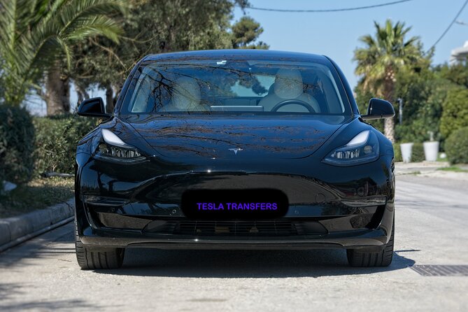 Private Transfer from Athens Airport to Athens City with Tesla - The airport pickup: flight tracking and a name sign that actually helps