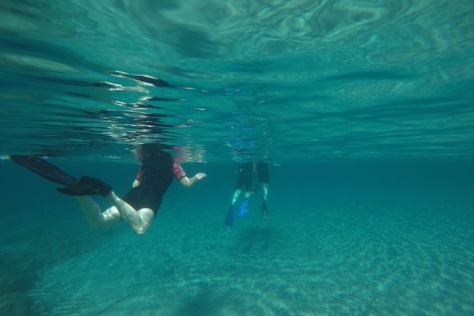 Snorkeling and swimming tour to the Poseidon's temple at Sounio cape - Vouliagmeni Lake stop, where the pace loosens